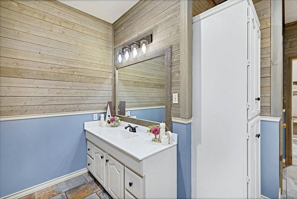7709 Fm 902 Sherman, TX 75092 - Photo 15 of 39 a bathroom with a sink and a mirror
