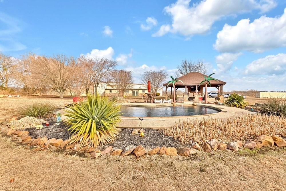 7709 Fm 902 Sherman, TX 75092 - Photo 28 of 39 a view of a lake with a nearby beach