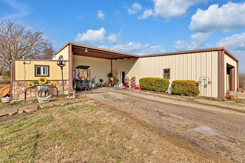 7709 Fm 902 Sherman, TX 75092 - Photo 5 of 39 a front view of a house with basket ball court