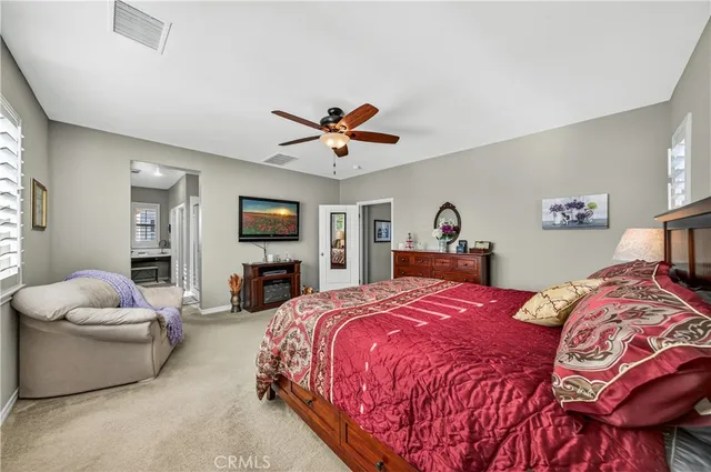 a bedroom with a bed and a couch