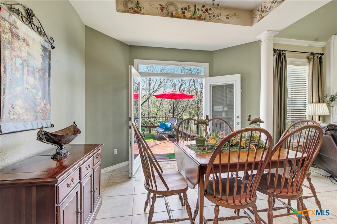 200 Carriage House Road Salado, TX 76571 - Photo 16 of 43 a view of a dining room with furniture and chandelier