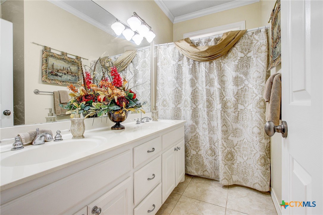 200 Carriage House Road Salado, TX 76571 - Photo 25 of 43 a bathroom with a mirror sink and a mirror