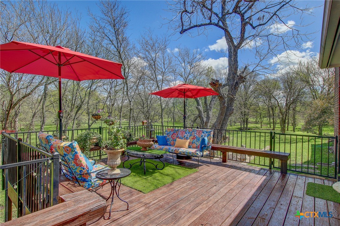 200 Carriage House Road Salado, TX 76571 - Photo 37 of 43 an outdoor sitting area with furniture and wooden deck
