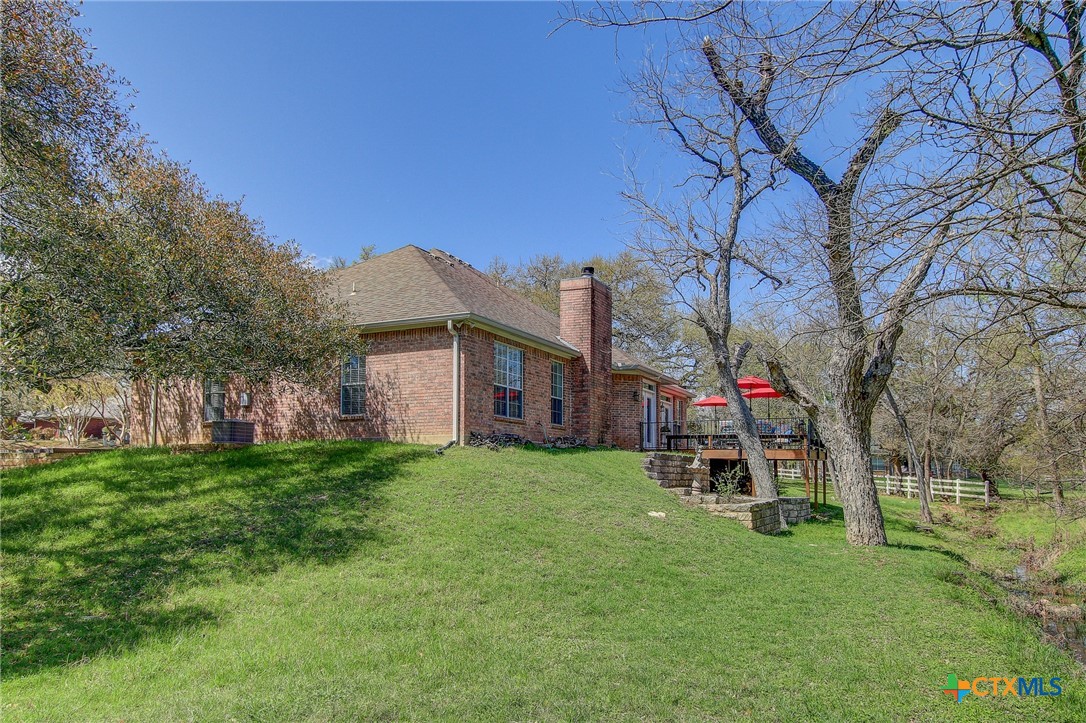 200 Carriage House Road Salado, TX 76571 - Photo 42 of 43 a utility room with yard and trees