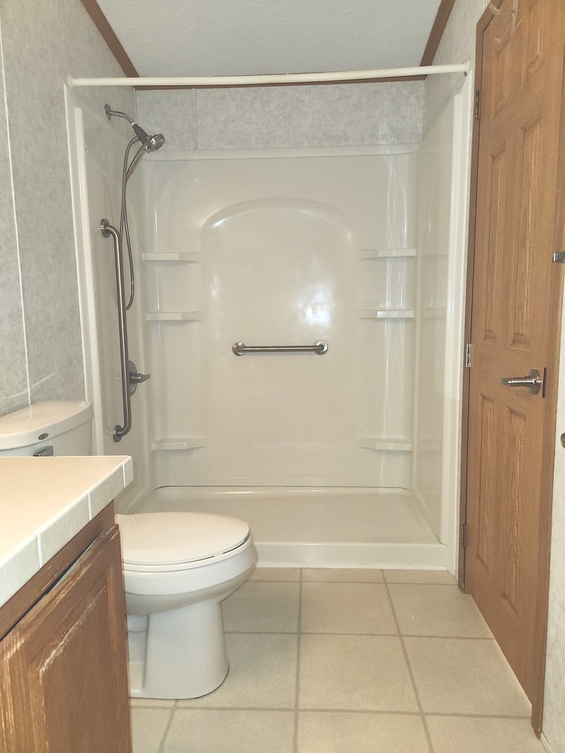 1027 Cherry Street Manteno, IL 60950 - Photo 16 of 20 a bathroom with a shower and a toilet