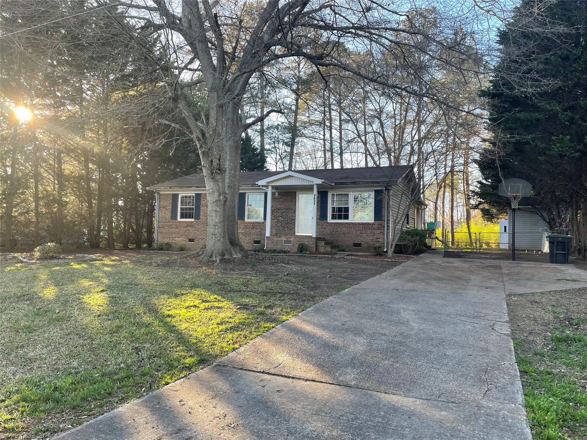 4631 Benfield Road Gastonia, NC 28056 - Photo 1 of 14 a view of a house with a yard and large tree