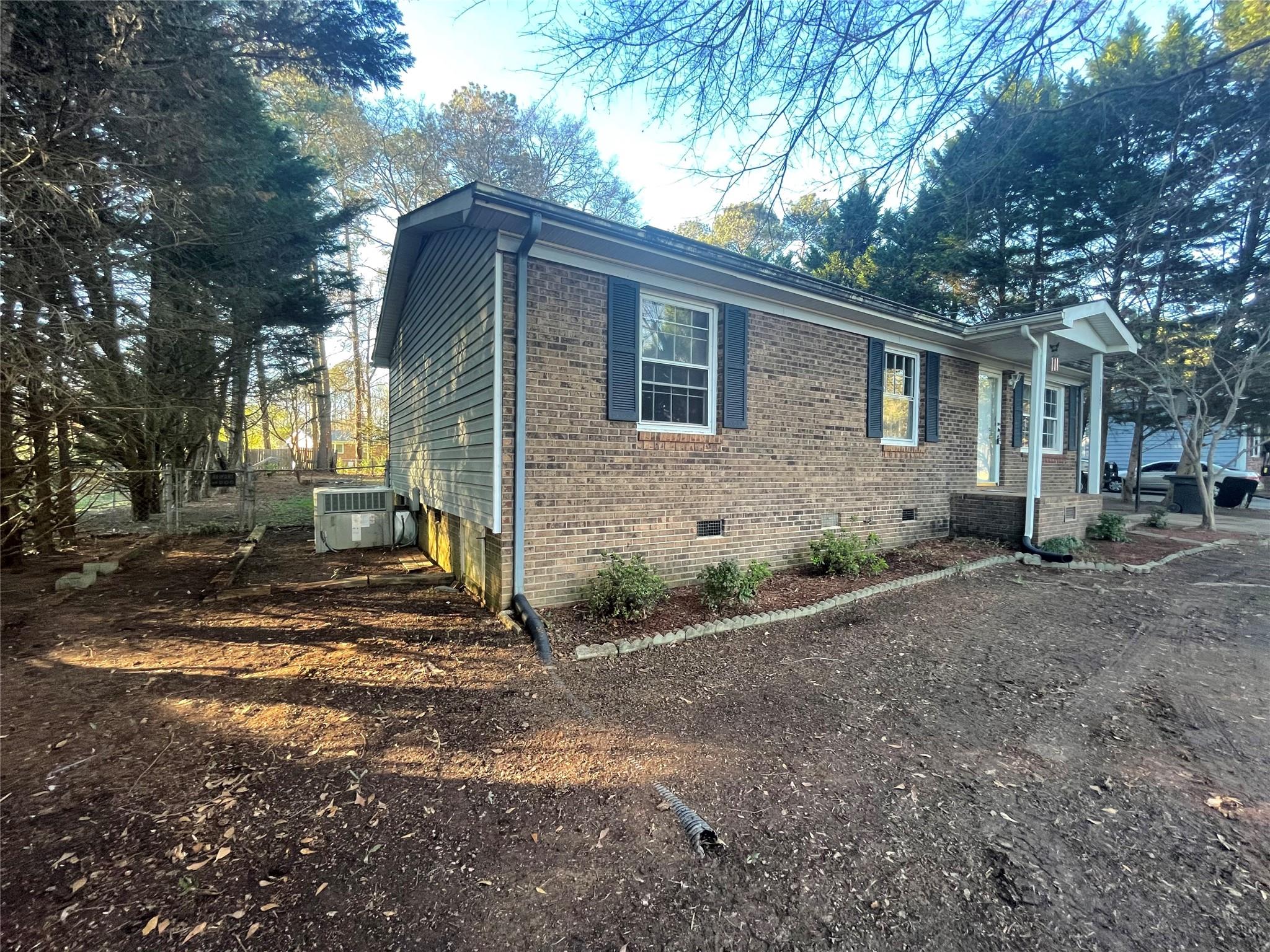4631 Benfield Road Gastonia, NC 28056 - Photo 3 of 14 a view of a house with a yard