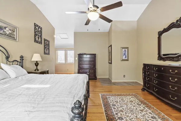 an aerial view of a houses with a lake view