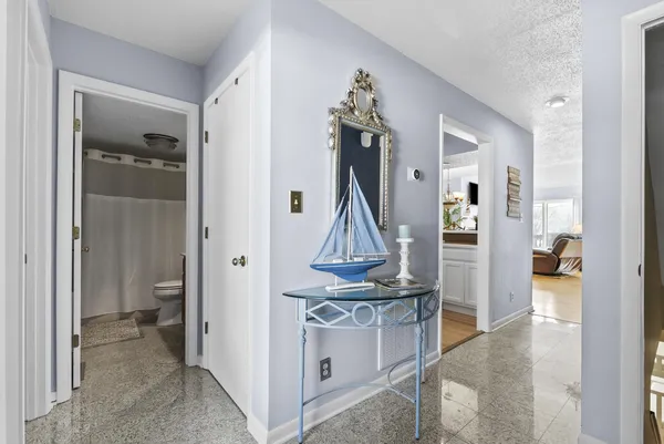 a view of entryway and kitchen