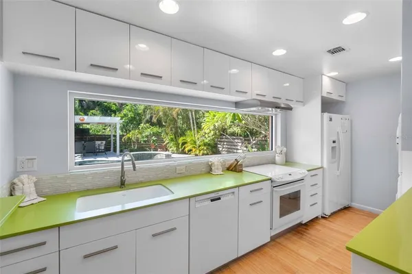 a kitchen with a large window and couch