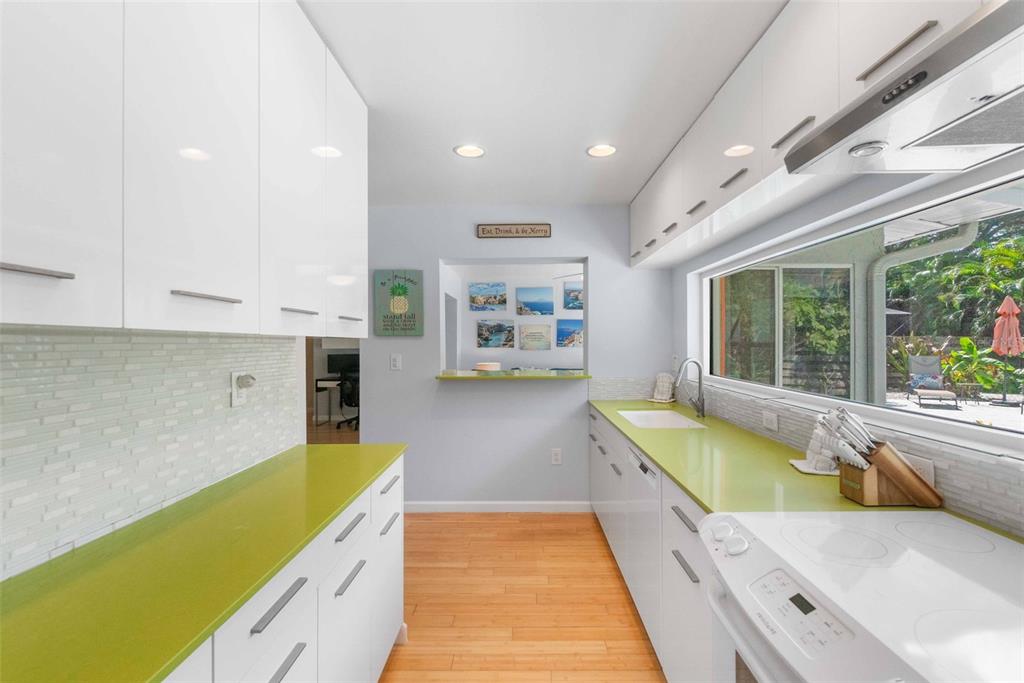 680 41st Street Sarasota, FL 34234 - Photo 13 of 42 a swimming pool with large window