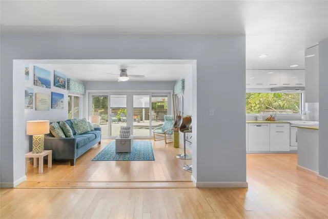 a living room with furniture and a potted plant