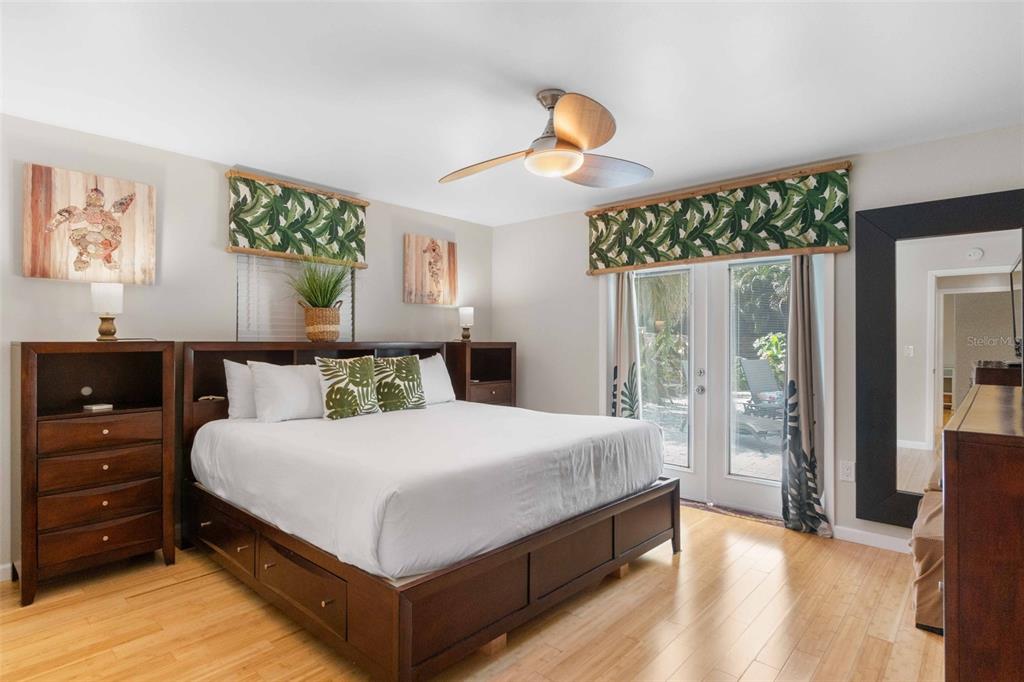 680 41st Street Sarasota, FL 34234 - Photo 25 of 42 a bedroom with a bed and a night stand