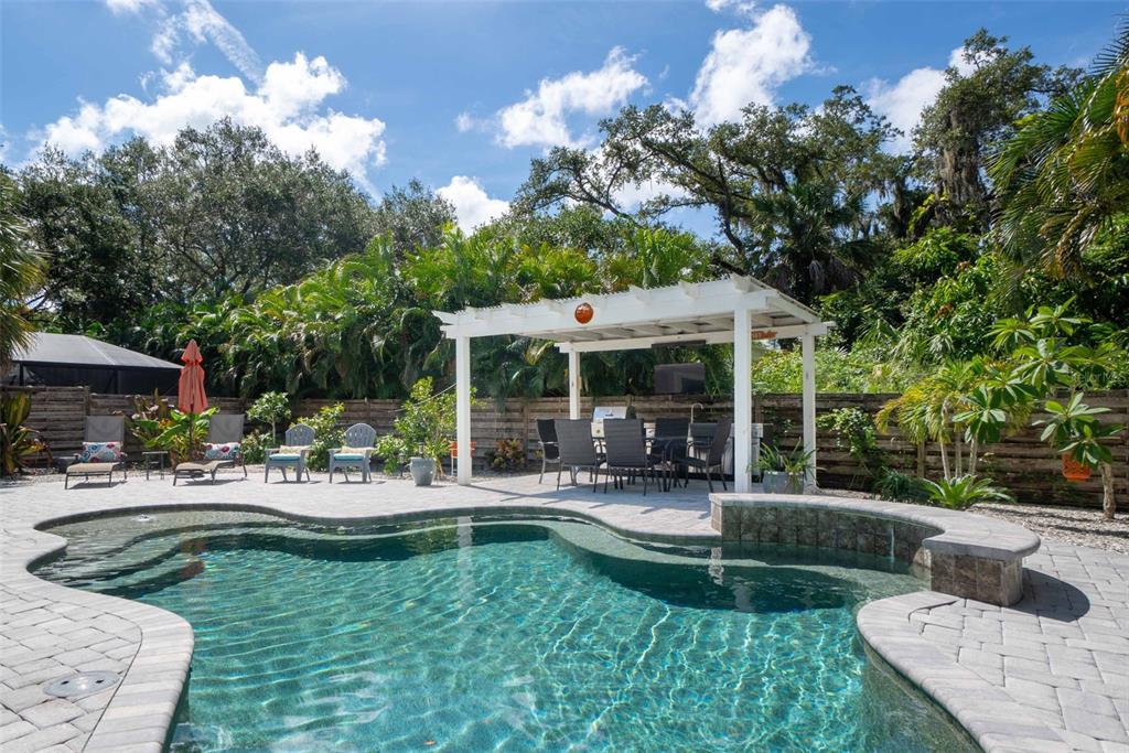 680 41st Street Sarasota, FL 34234 - Photo 30 of 42 a view of a house with a yard patio and swimming pool