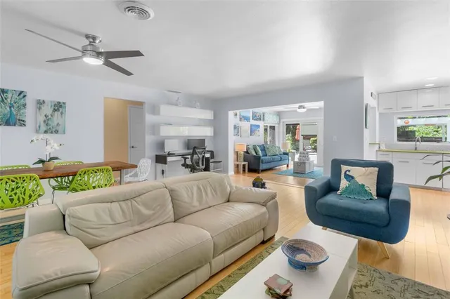 a living room with furniture flat screen tv and a fireplace