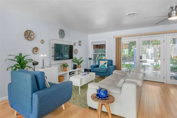 a living room with furniture and a large window