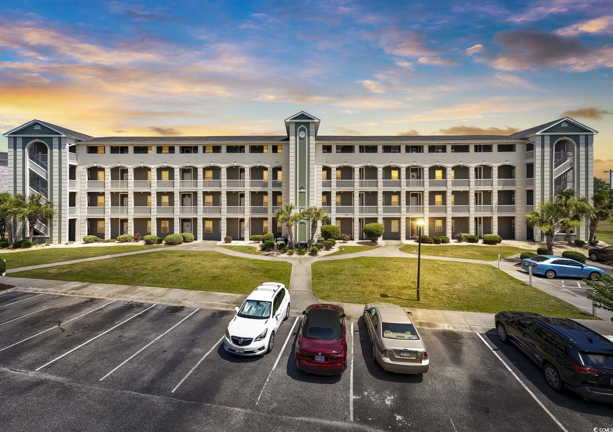 131 Waypoint Ridge Avenue, Unit Q28 Little River, SC 29566 - Photo 1 of 36 View of outdoor building at dusk