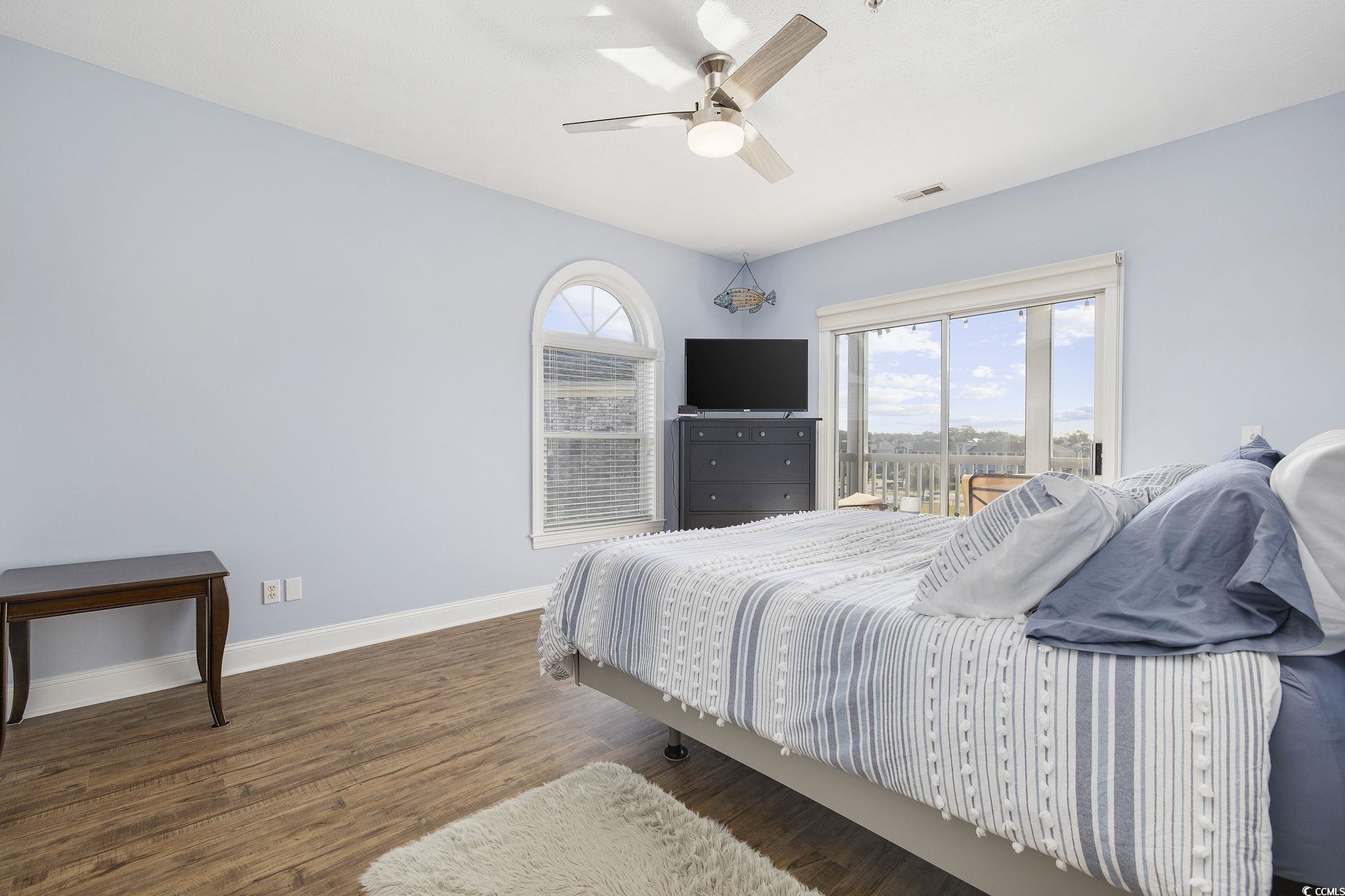 131 Waypoint Ridge Avenue, Unit Q28 Little River, SC 29566 - Photo 13 of 36 Bedroom featuring dark wood-type flooring, multipl