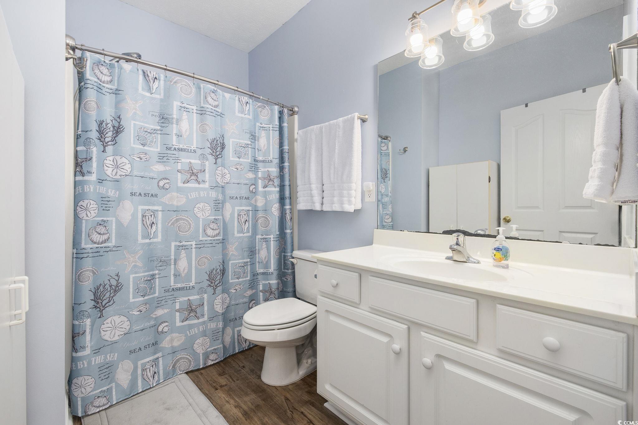 131 Waypoint Ridge Avenue, Unit Q28 Little River, SC 29566 - Photo 16 of 36 Bathroom featuring curtained shower, hardwood / wo