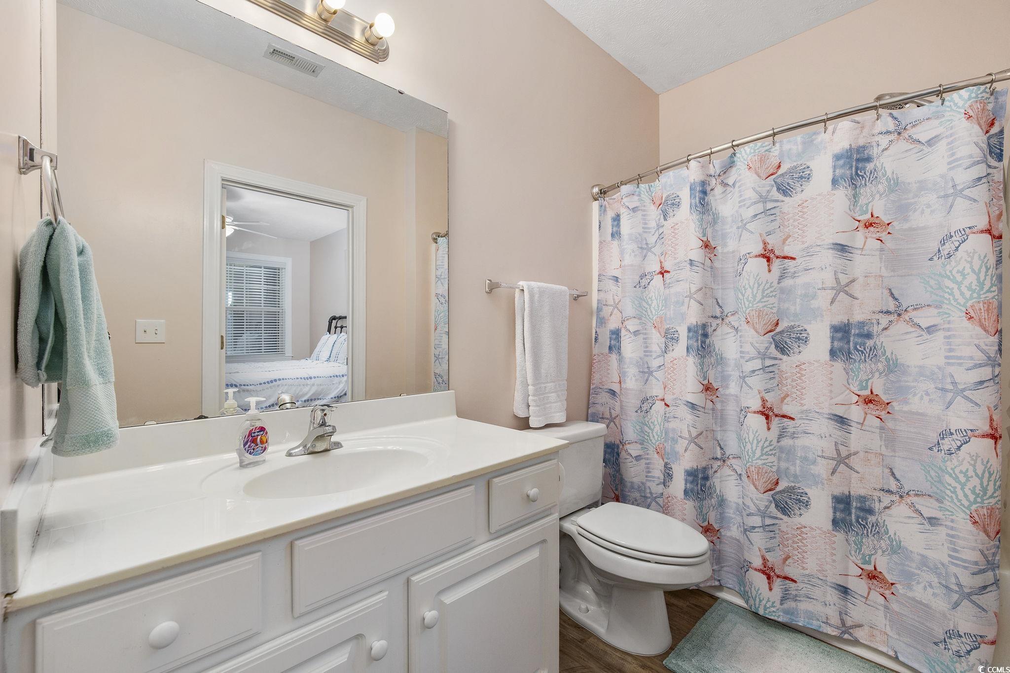 131 Waypoint Ridge Avenue, Unit Q28 Little River, SC 29566 - Photo 21 of 36 Bathroom featuring ceiling fan, hardwood / wood-st