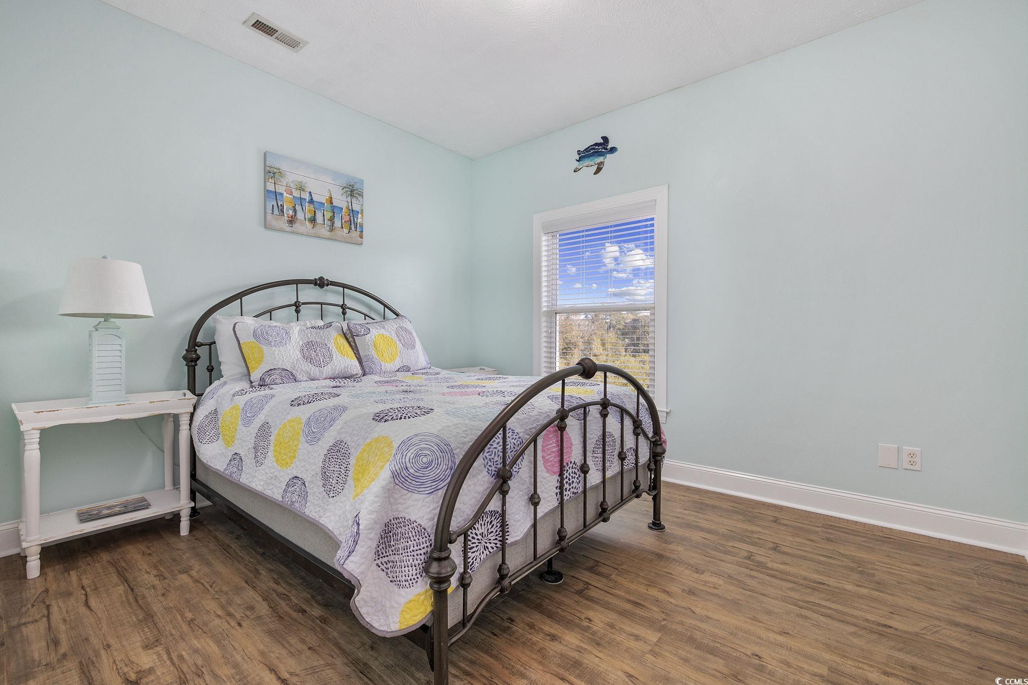 131 Waypoint Ridge Avenue, Unit Q28 Little River, SC 29566 - Photo 22 of 36 Bedroom featuring dark hardwood / wood-style floor