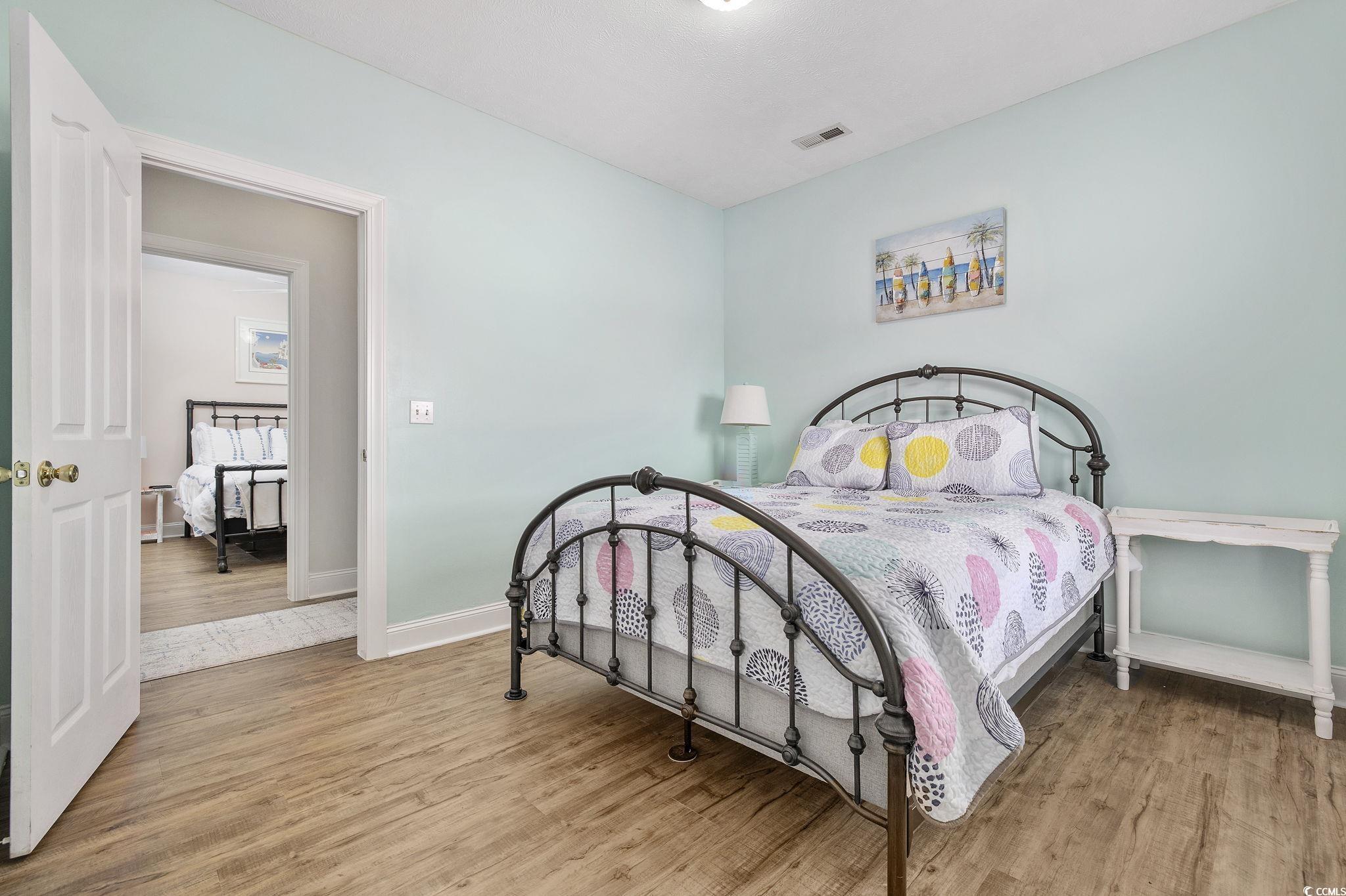 131 Waypoint Ridge Avenue, Unit Q28 Little River, SC 29566 - Photo 23 of 36 Bedroom with wood-type flooring