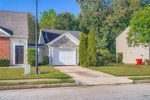 a front view of a house with a yard