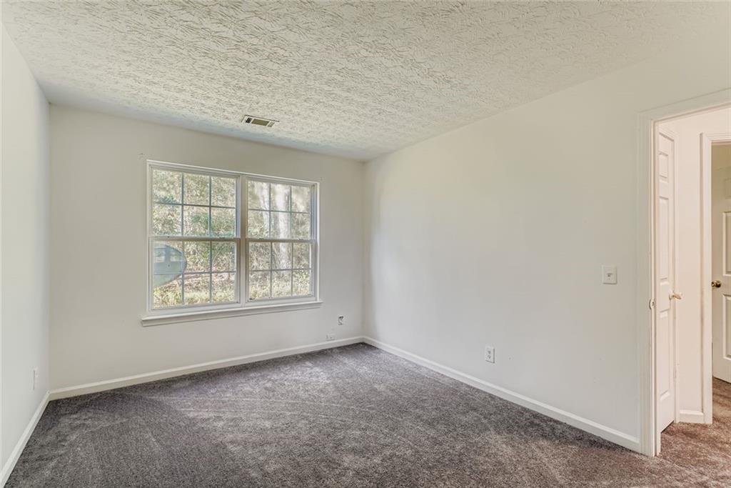1025 Lakeside Circle Covington, GA 30016 - Photo 23 of 32 an empty room with a window