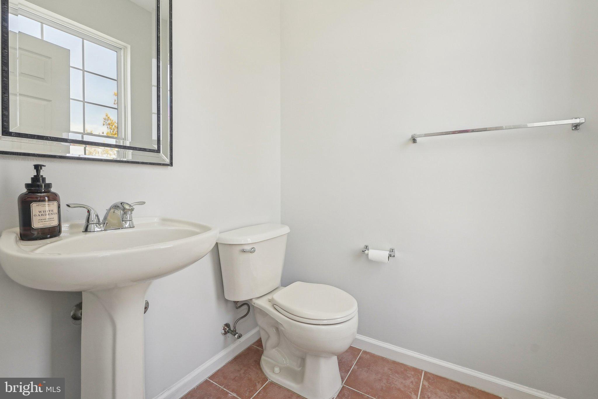 25 Keswick Road East Windsor, NJ 08520 - Photo 13 of 41 a bathroom with a sink a toilet and a mirror