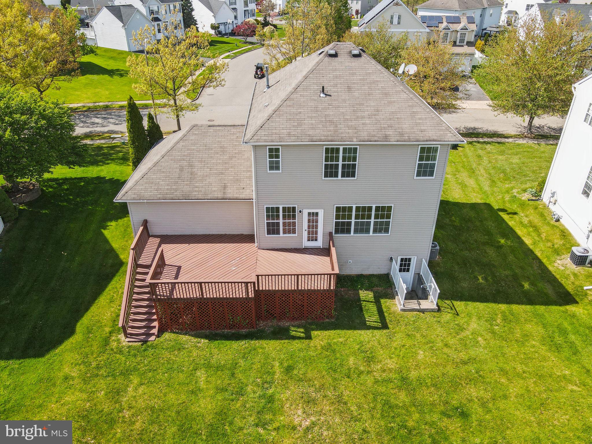 25 Keswick Road East Windsor, NJ 08520 - Photo 35 of 41 a aerial view of a house with swimming pool and a yard