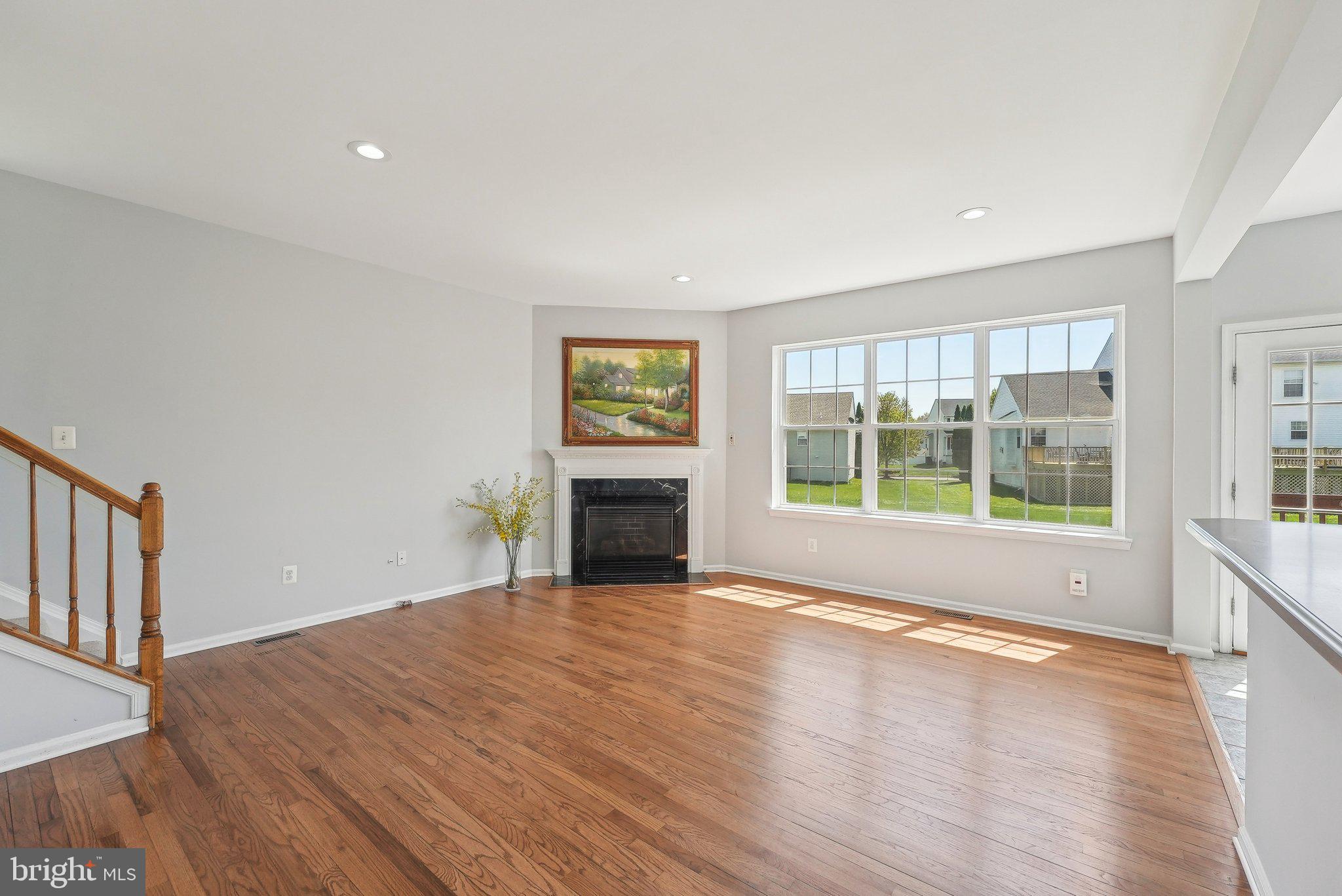 25 Keswick Road East Windsor, NJ 08520 - Photo 6 of 41 a view of an empty room with a window and wooden floor