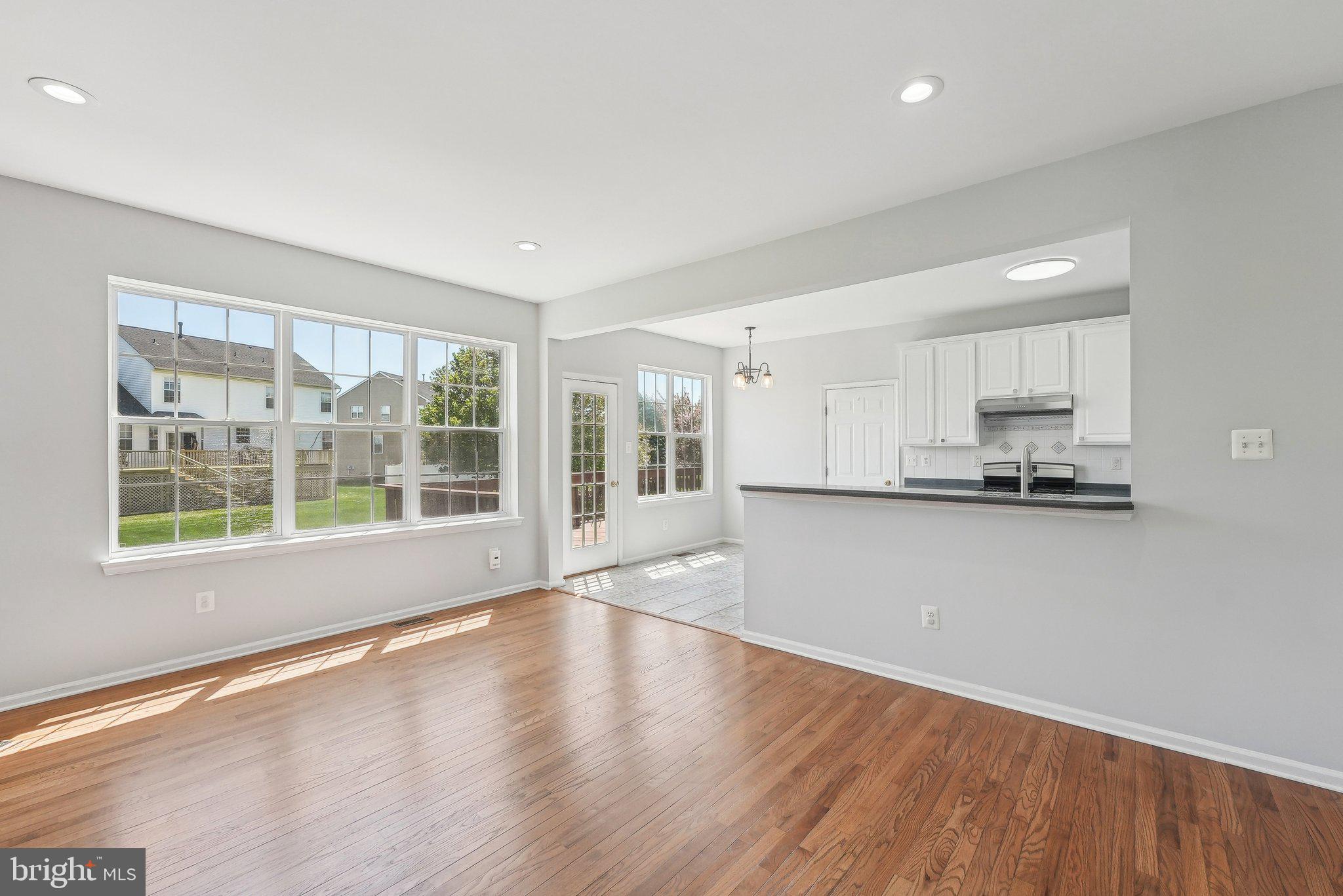 25 Keswick Road East Windsor, NJ 08520 - Photo 8 of 41 a view of an empty room with wooden floor and a window