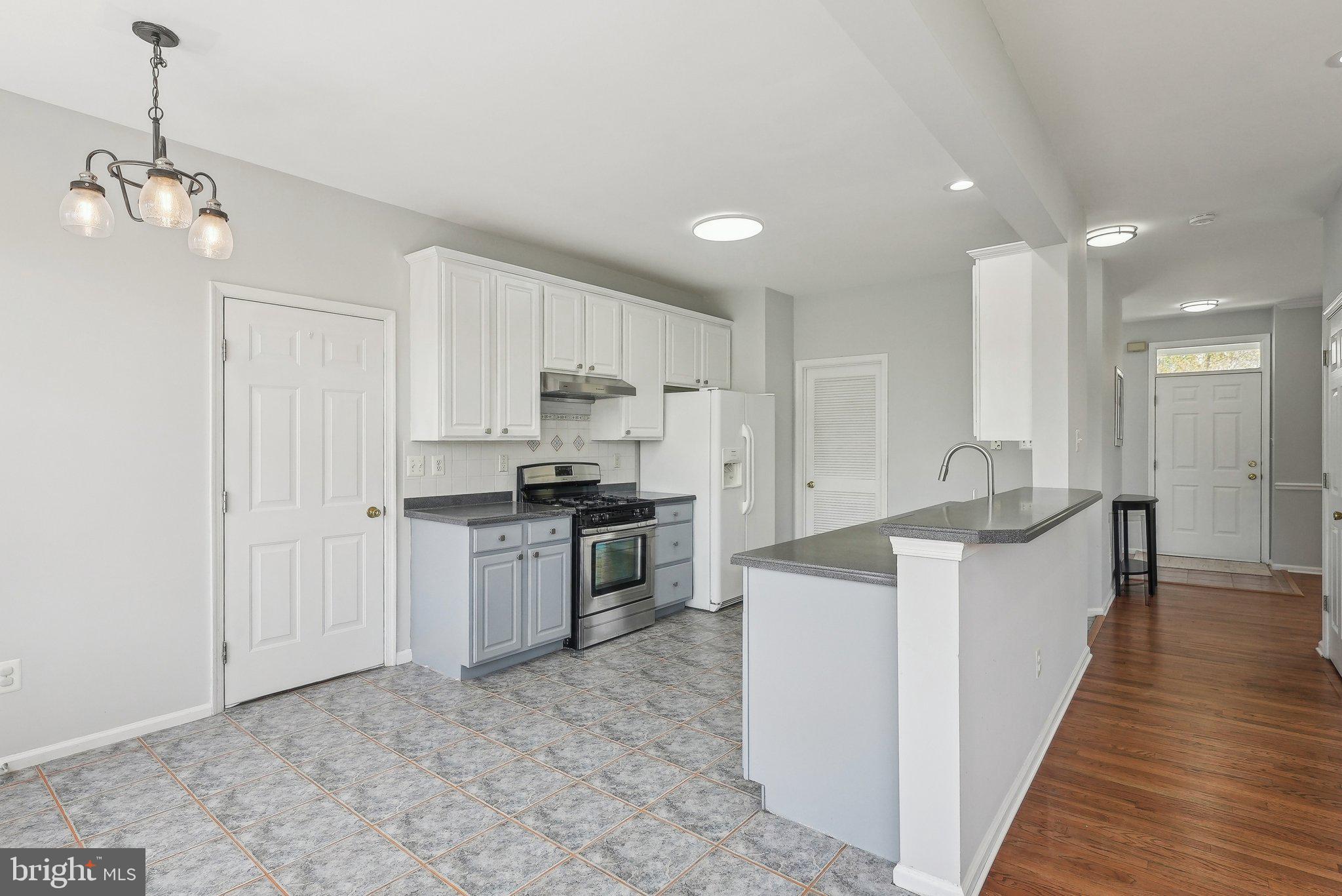 25 Keswick Road East Windsor, NJ 08520 - Photo 10 of 41 a large kitchen with stainless steel appliances granite countertop a sink and cabinets