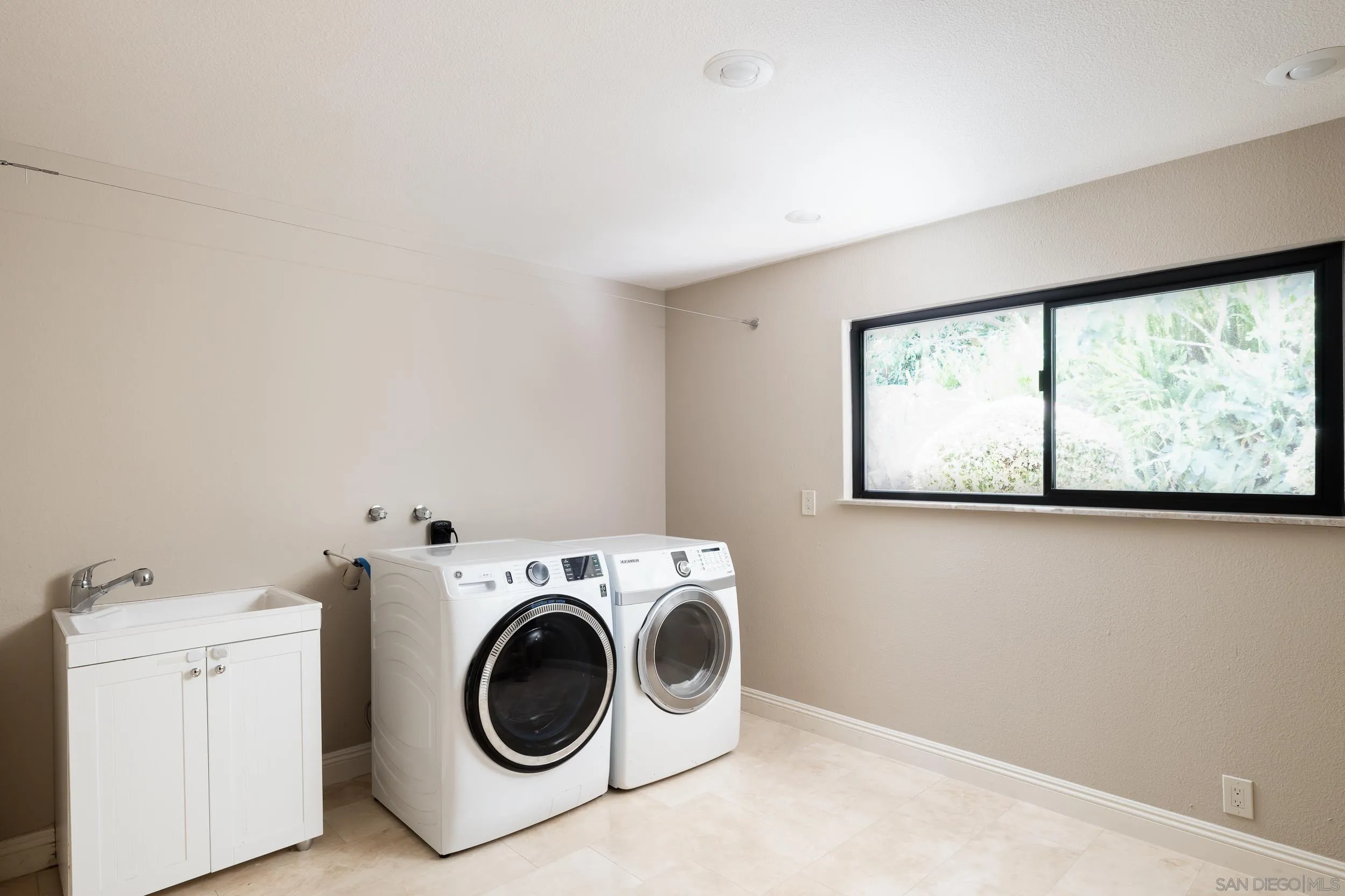 15951 Lime Grove Road Poway, CA 92064 - Photo 30 of 52 a utility room with dryer and washer