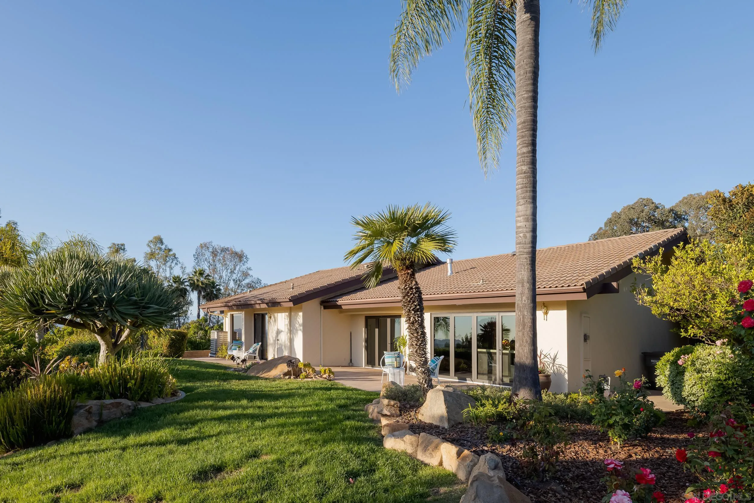 15951 Lime Grove Road Poway, CA 92064 - Photo 32 of 52 a front view of a house with a garden