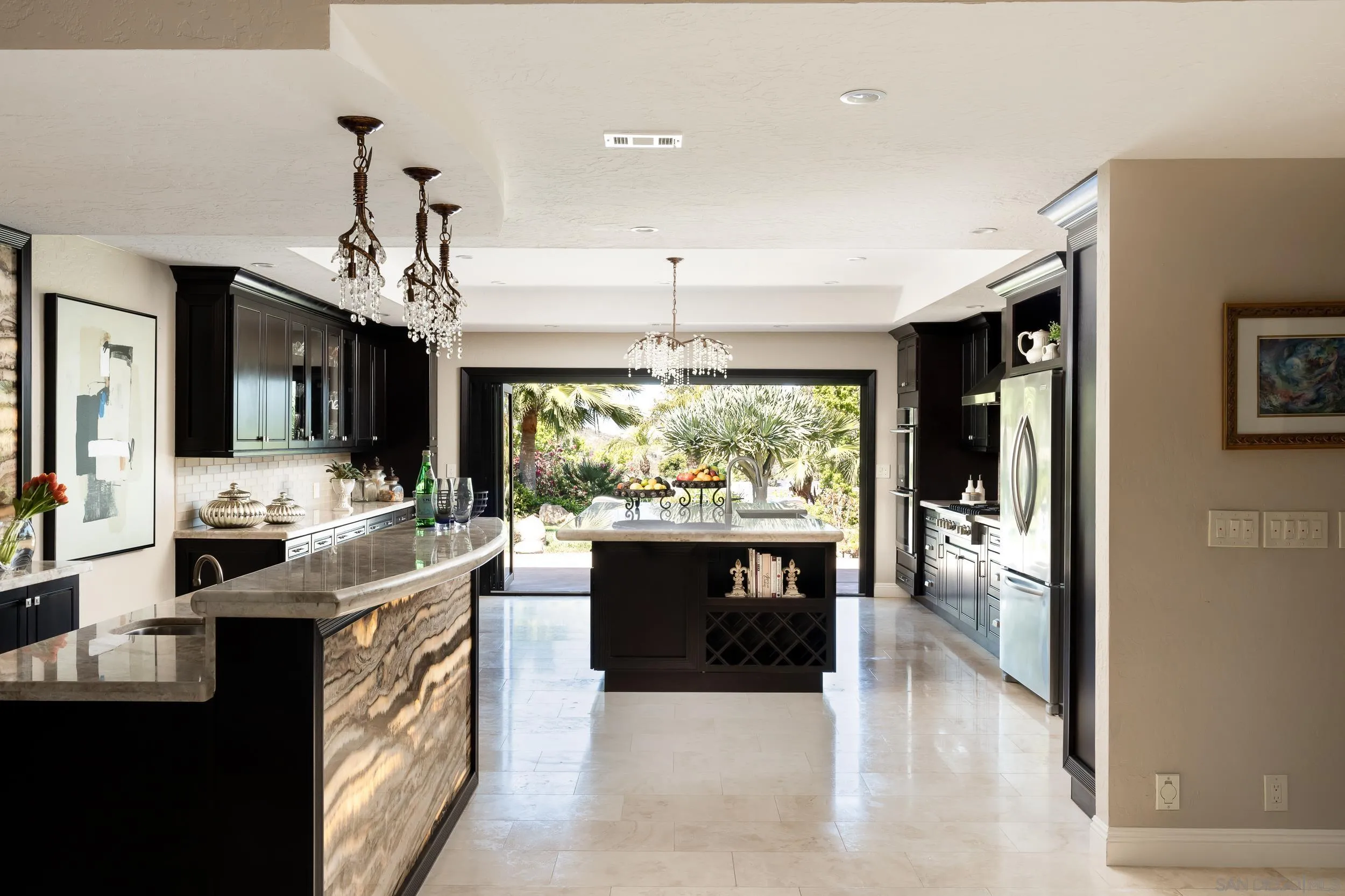 15951 Lime Grove Road Poway, CA 92064 - Photo 9 of 52 a large white kitchen with a large window and stainless steel appliances