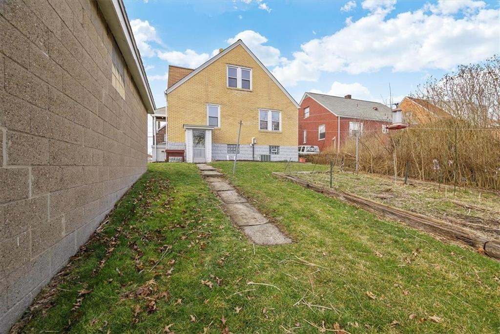 508 Maple Street West Mifflin, PA 15122 - Photo 26 of 31 a view of a front of house with a yard