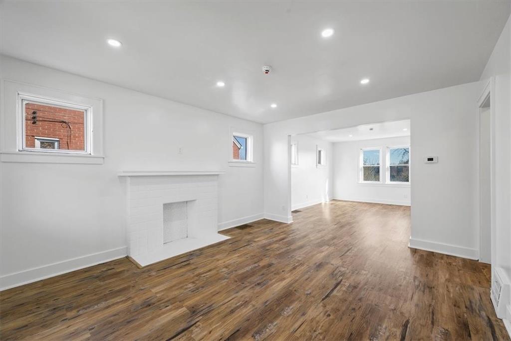 508 Maple Street West Mifflin, PA 15122 - Photo 5 of 31 an empty room with wooden floor and windows