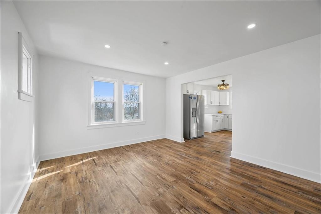 508 Maple Street West Mifflin, PA 15122 - Photo 7 of 31 a view of an empty room with wooden floor and a window
