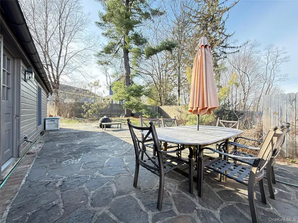 a view of an outdoor space with a table and chairs