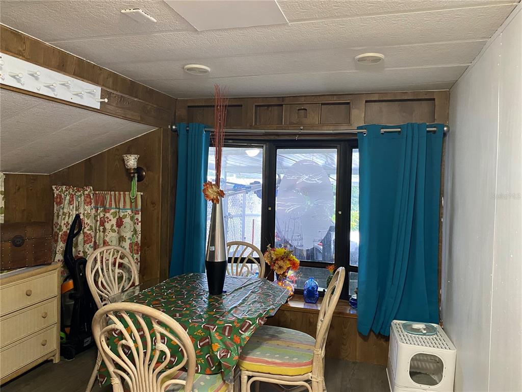 9475 Gray Fox Drive Weeki Wachee, FL 34613 - Photo 5 of 9 a room with furniture and a window