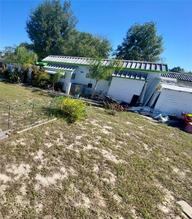 9475 Gray Fox Drive Weeki Wachee, FL 34613 - Photo 7 of 9 a view of a house with a yard