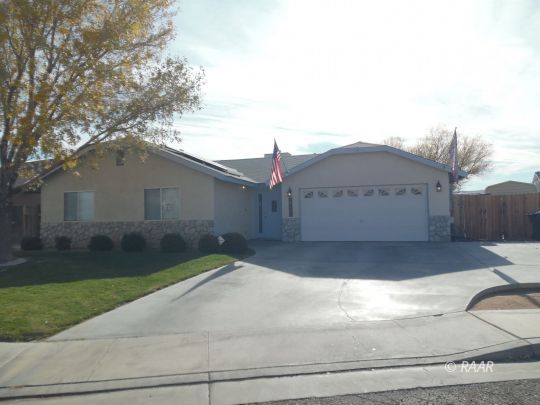 417 Mavis Court Ridgecrest, CA 93555 - Photo 1 of 31 a view of a white house with a small yard and large tree