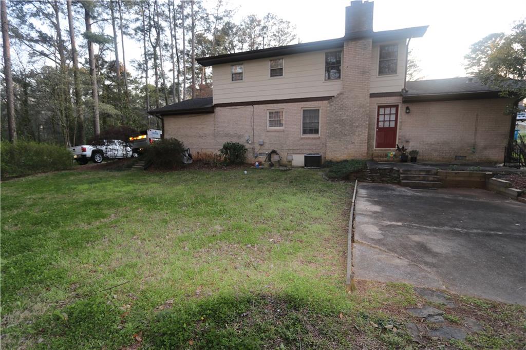1302 Stephens Street Southwest Lilburn, GA 30047 - Photo 6 of 13 a view of a house with backyard