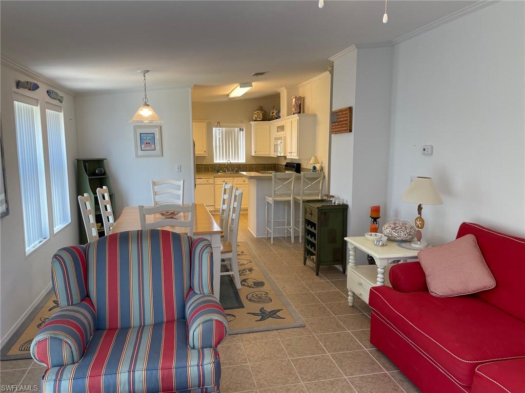 11262 Olive Circle Punta Gorda, FL 33955 - Photo 7 of 18 a living room with furniture and a table