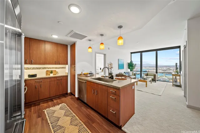 a kitchen with a stove a sink and a refrigerator