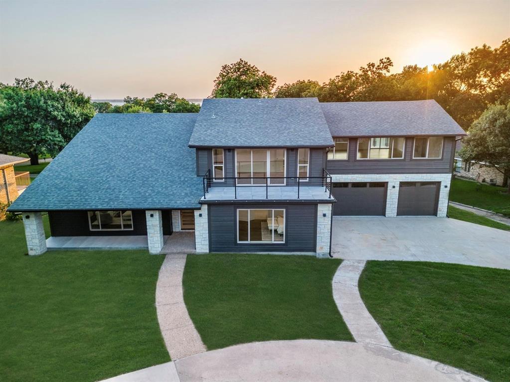 1408 South Alamo Road Rockwall, TX 75087 - Photo 1 of 40 a front view of a house with a yard