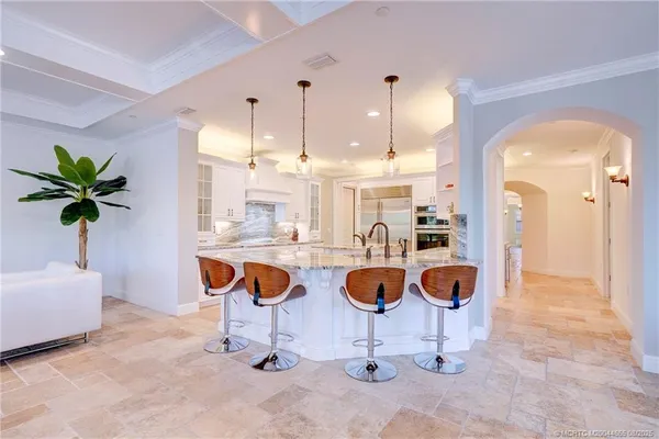 a kitchen with stainless steel appliances granite countertop a sink and cabinets