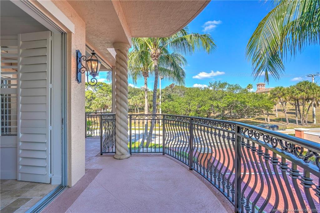 1528 Northeast Outrigger Landings Drive, Unit 208 Jensen Beach, FL 34957 - Photo 30 of 79 a view of balcony with wooden floor and outdoor space