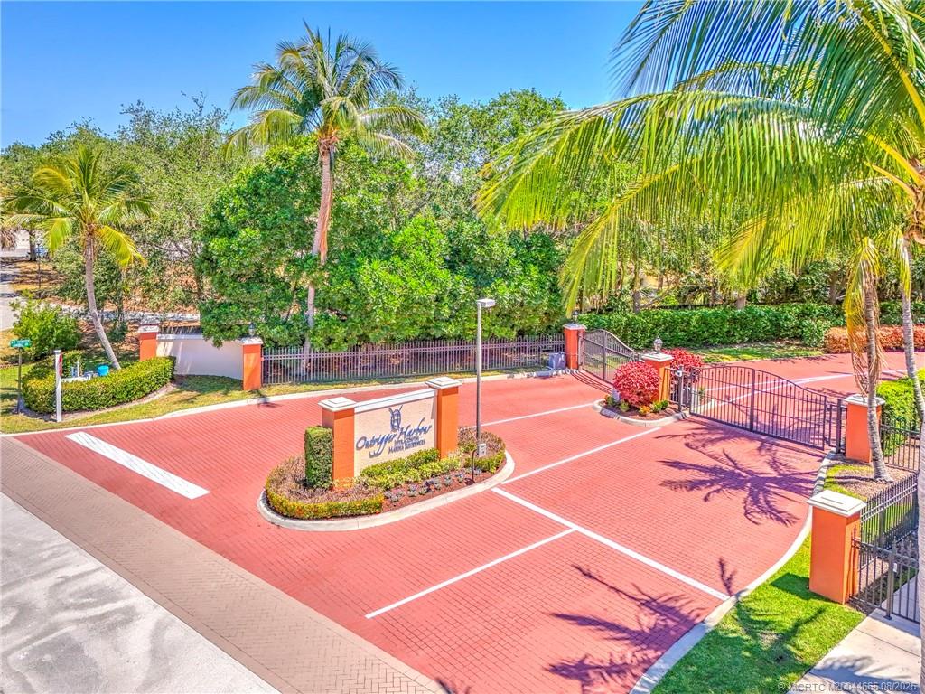 1528 Northeast Outrigger Landings Drive, Unit 208 Jensen Beach, FL 34957 - Photo 3 of 79 a view of a swimming pool with a patio